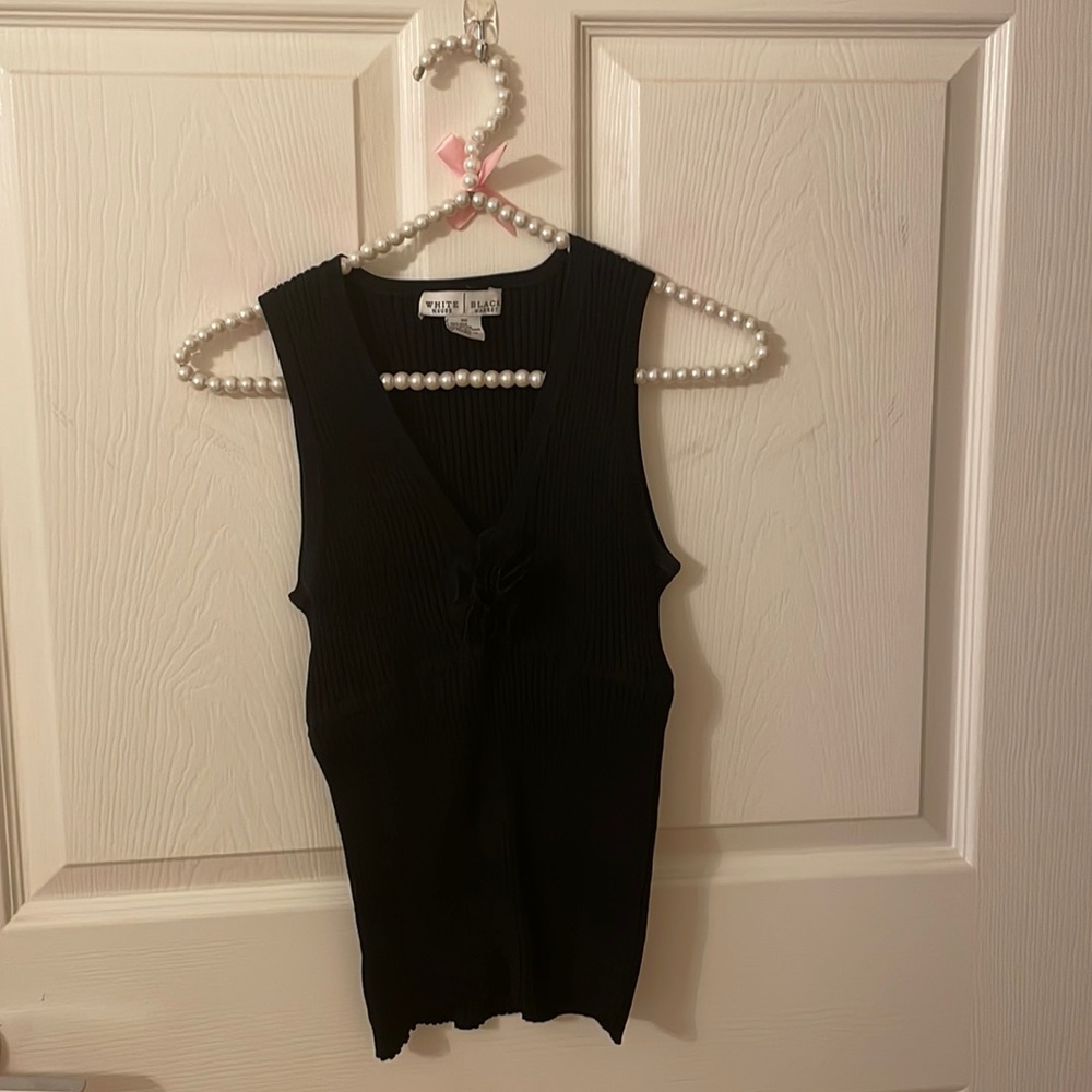 Black knit top with flower detail